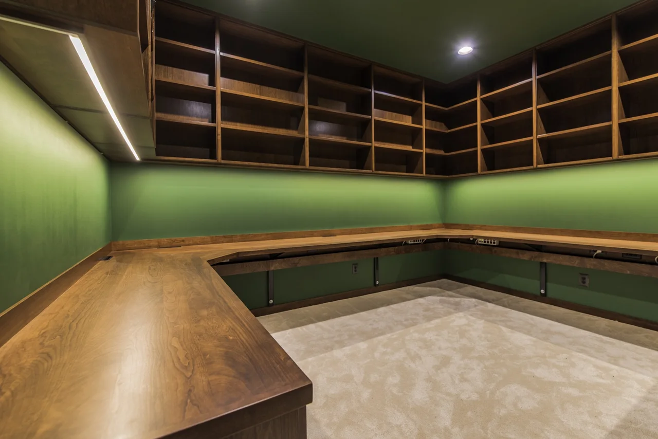 Floor-to-ceiling painted built-in library cabinetry