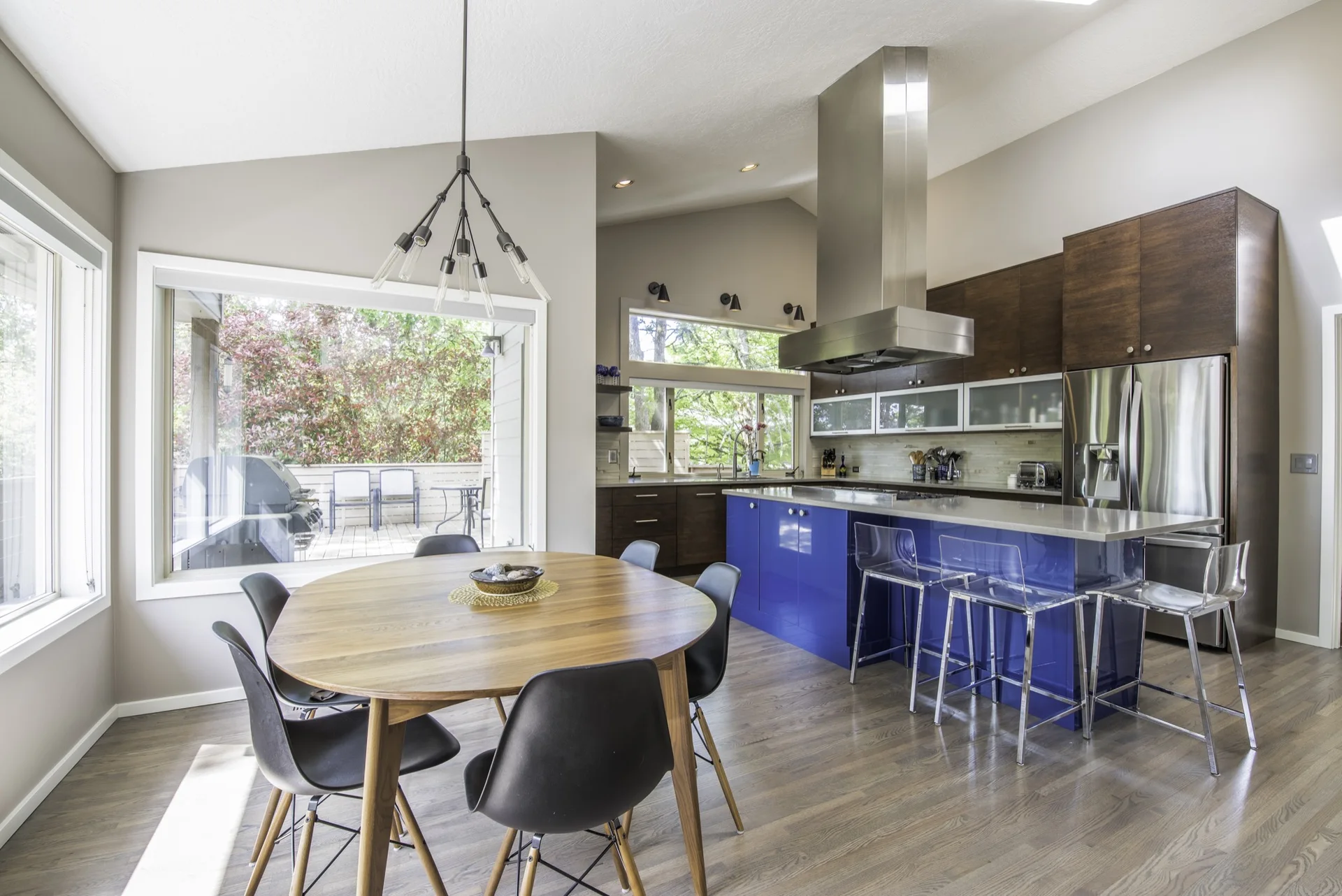 Wide view of the modern walnut kitchen and island