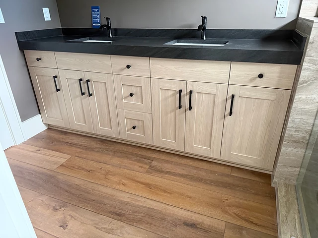 Light wood double vanity with dark top